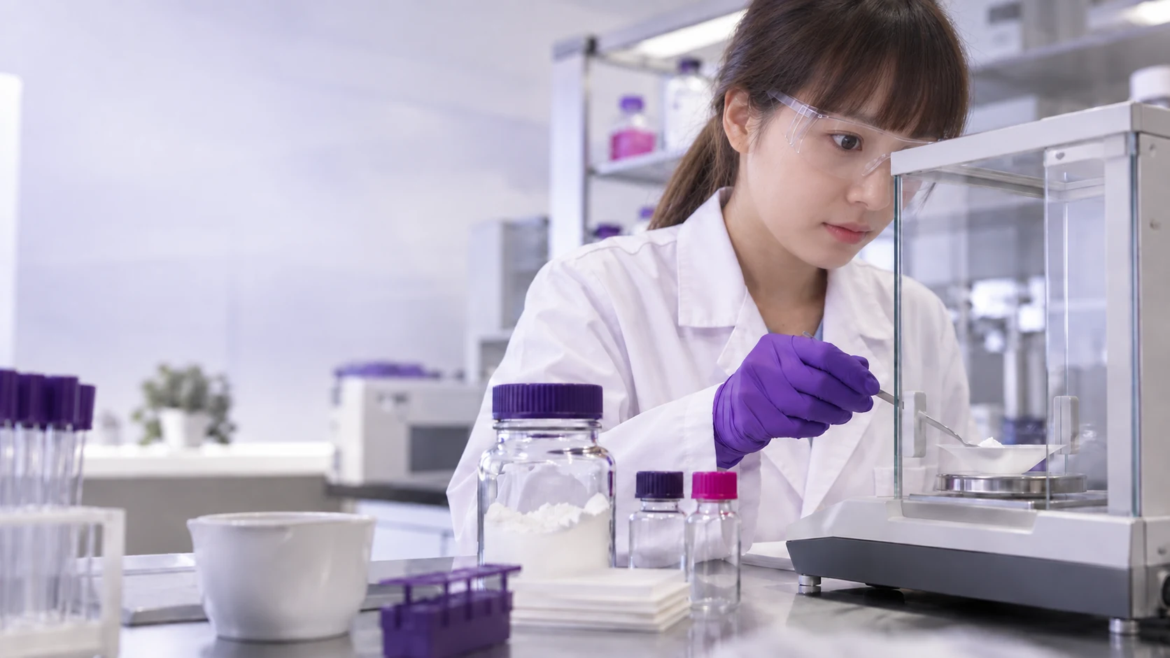 Technician preparing intermediate samples with a balance — project illustration